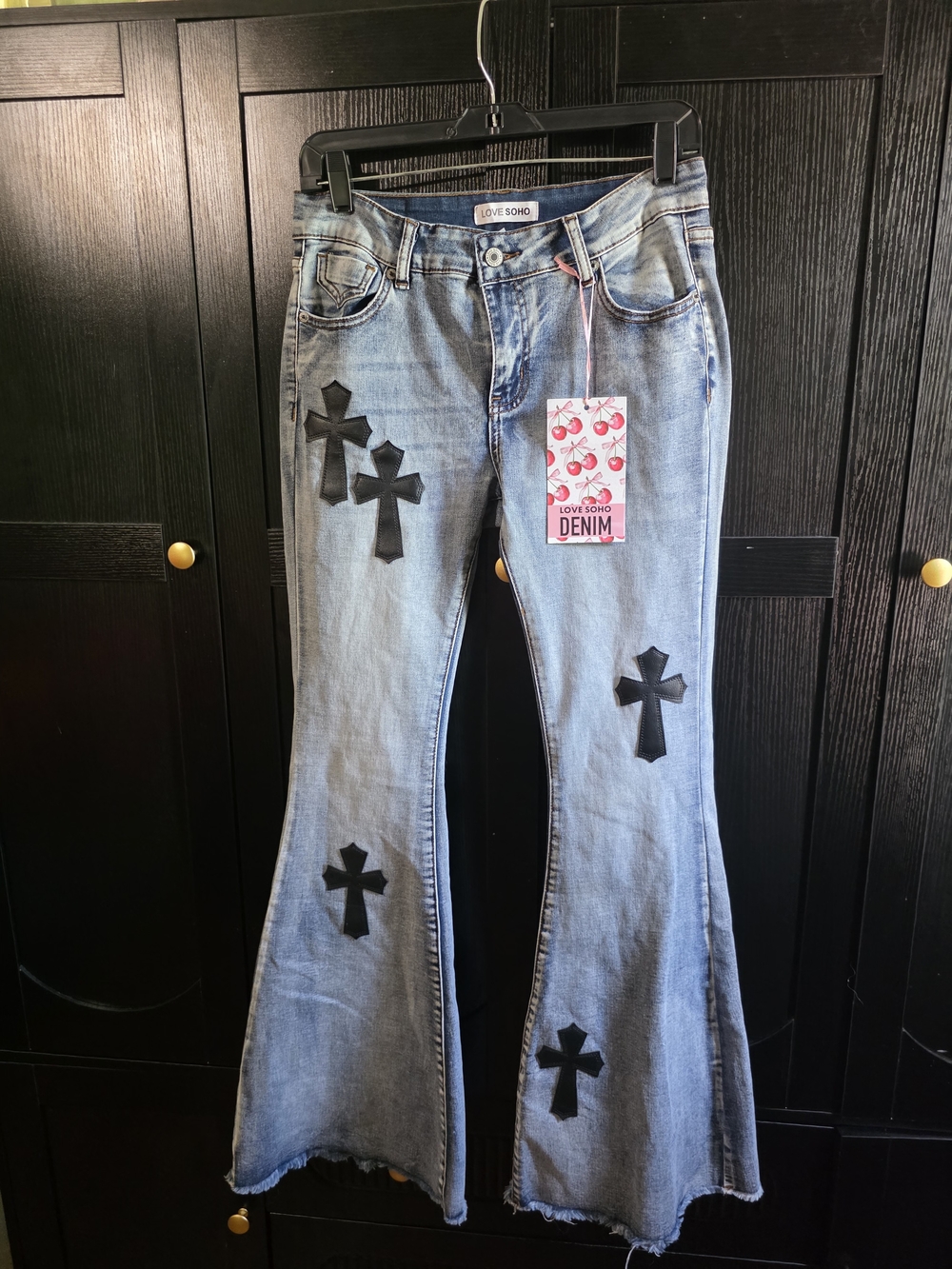 Light Blue Flare Jeans with Black Cross Appliqués